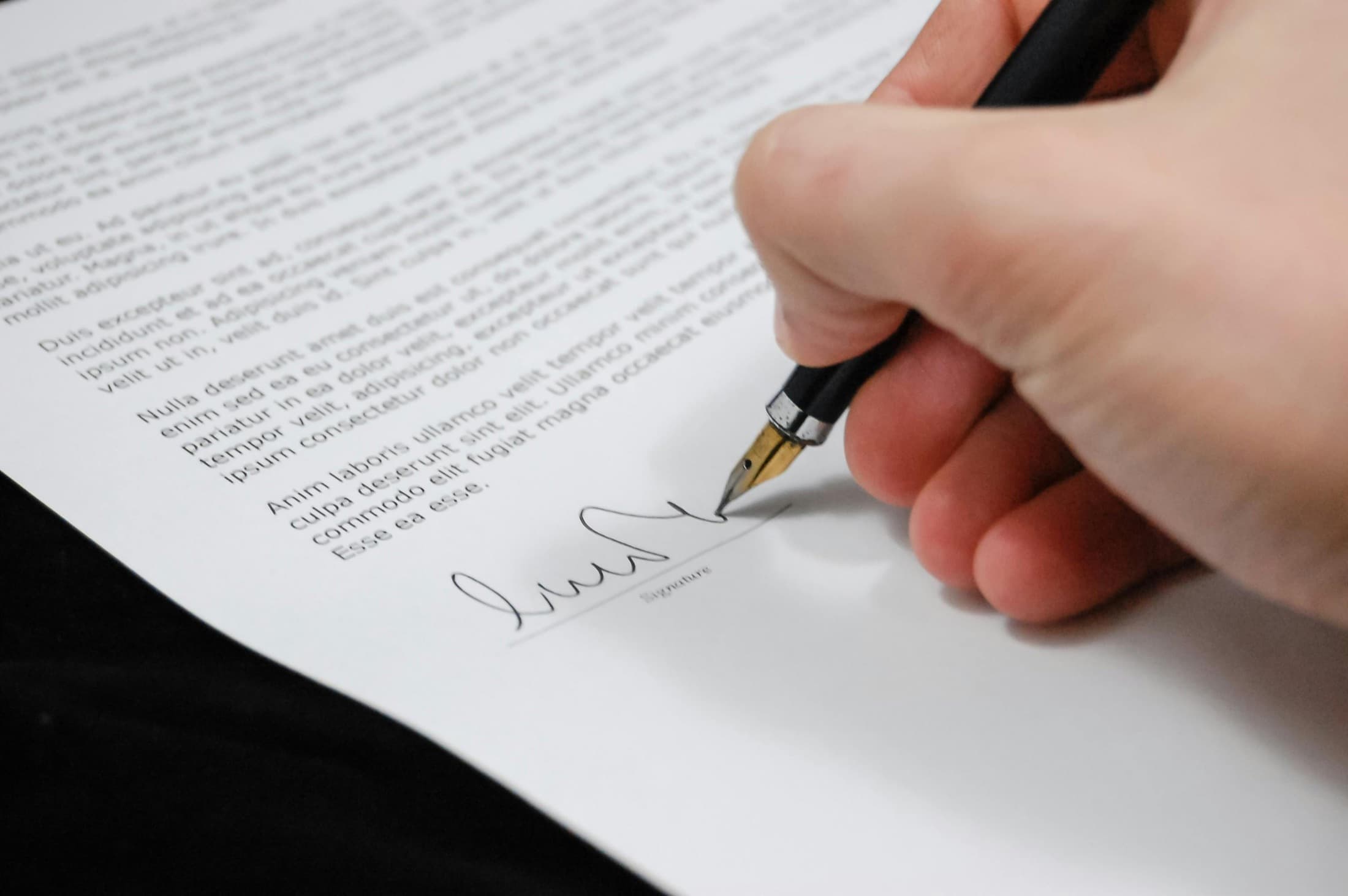 Contract signing for a Carmol Construction repair and maintenance project